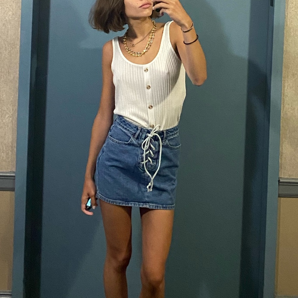 Vintage denim skirt from high end soho vintage store — NYC. Blue with white rope